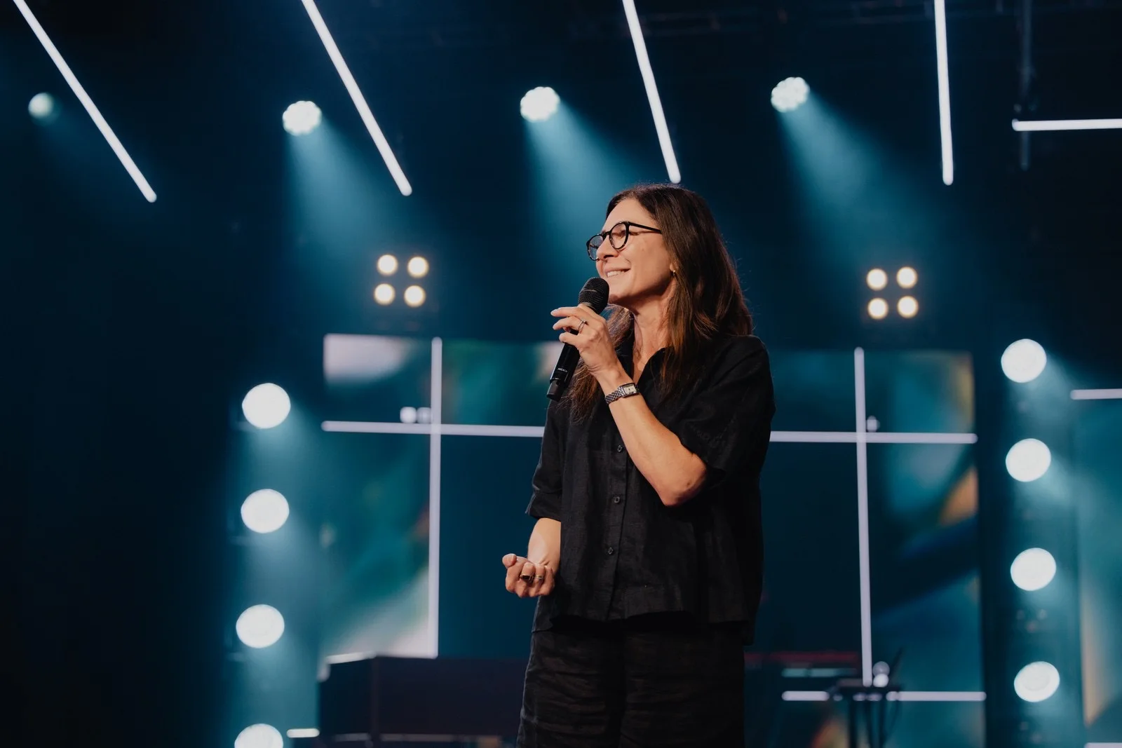 A speaker sharing a message at The Belonging Co