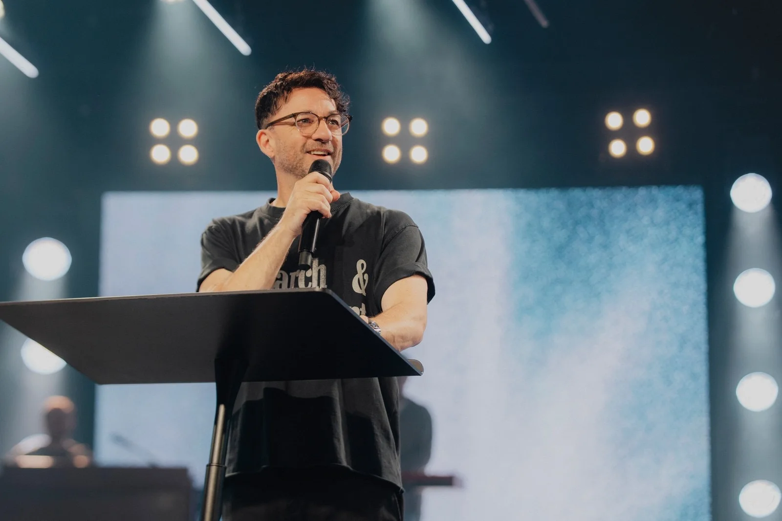 A speaker sharing a message at The Belonging Co